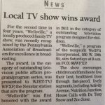 News article with headline reading "Local TV show wins award."